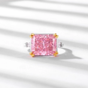 Three-stone pink rectangular high carbon diamond ring with silver band and gold prongs