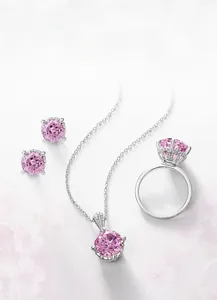 Detail of S925 silver jewelry set with 10x10mm round cut pink gemstones and polished finish