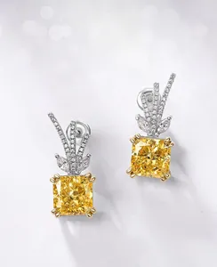 Macro detail of S925 sterling silver antler earrings with yellow ice-cut carbon diamonds