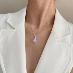 Elegant S925 silver necklace featuring a large pink lotus diamond pendant on a model