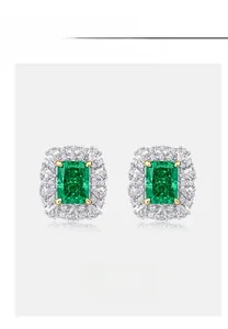Detailed view of S925 silver emerald-cut halo earrings with 18K gold plated prongs