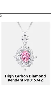 Detailed view of an oval pink high carbon diamond pendant necklace with white side stones