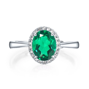 Vintage S925 silver halo ring with large oval emerald green stone and white zircon accents