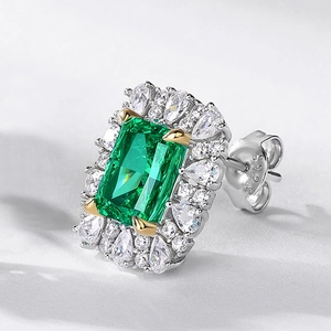 S925 Sterling Silver emerald stud earring with halo diamonds shown from a side angle