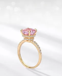 Macro shot of pink ice-cut carbon diamond ring with 18k gold plating and pave settings