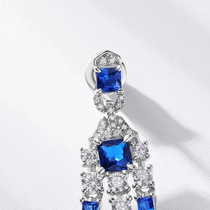 Elegant vintage S925 silver drop earrings with emerald cut blue gemstones and tiny diamonds