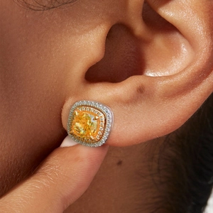 Luxurious cushion cut yellow gemstone earring with double halo pavé setting on ear
