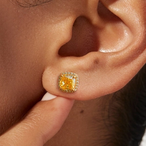 Macro shot of cushion cut yellow diamond halo stud earrings in S925 silver finish