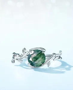 Macro detail of the silver moss agate ring with unique bionic branch and leaf design