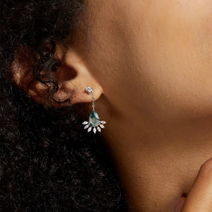 Detail of moss agate teardrop earrings with marquise cubic zirconia on a model