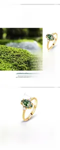 Macro shot of 925 silver gold ring with hexagonal moss agate stone and moss decor