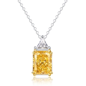 S925 silver necklace with yellow cushion cut pendant and silver link chain on white backdrop