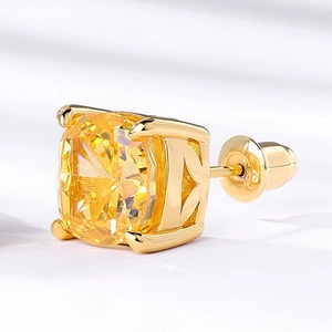 Square yellow diamond stud earring with 18k gold-tone four-prong setting and macro detail