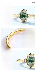 Macro detail of S925 silver ring with rectangle green moss agate and side high-carbon diamonds