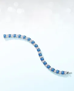 Detailed view of S925 silver bracelet featuring ice-cut blue and clear carbon diamonds