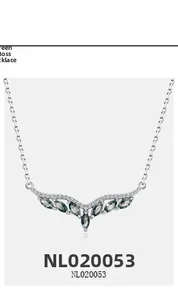 Macro detail of S925 silver angel wing necklace with marquise-cut green moss agate stones