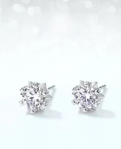 Macro shot of S925 silver moissanite stud earring with snowflake design and 6-prong setting