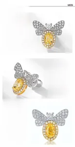 Detail of S925 silver bee earrings with yellow high-carbon diamond and gold plating