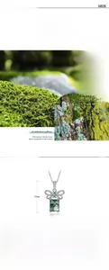 Detailed view of S925 silver bow pendant with green moss agate and carbon diamond