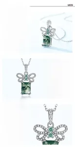 Macro detail of butterfly S925 silver pendant with green moss agate and cubic zirconia