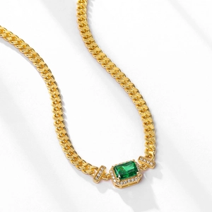 Gold-plated Cuban chain necklace with rectangular emerald pendant and pavé crystals