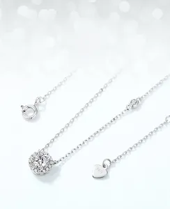 Detailed macro view of S925 sterling silver moissanite pendant with engraved heart tag