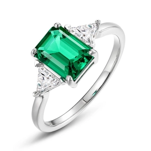 Eleganter Ring aus S925 Silber mit smaragdgeschliffenem grünem Stein und Seitenteilen