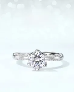 Detailed close-up of S925 silver moissanite ring with six-prong setting and laurel design