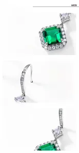 Macro shot of S925 silver emerald earrings with halo setting and square cut gemstone