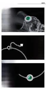 Macro detail of S925 sterling silver stamp and emerald green stone on link bracelet