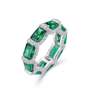 Elegant S925 silver eternity ring with emerald-cut green gemstones and white side diamonds