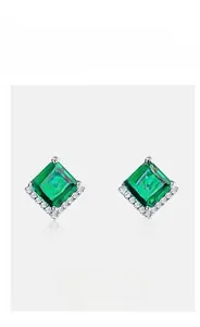 Close-up of square emerald stud earrings in S925 silver with decorative halo