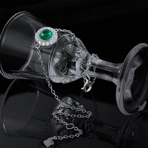 Elegant S925 silver bracelet with round emerald stone and sparkling zircon halo