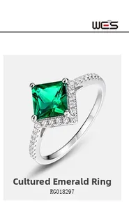 Macro shot of a S925 silver ring featuring square lab-grown emerald and sparkling diamonds