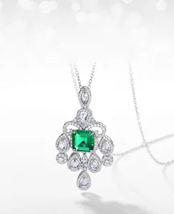 Macro detail of emerald-cut lab-grown gemstone pendant with vintage zircon frame