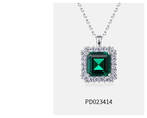 Macro shot of square emerald pendant necklace with halo of small diamonds in S925 silver