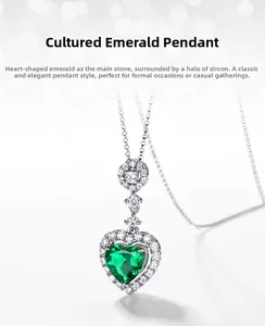 Macro detail of heart-cut lab emerald pendant with sparkling zircon halo setting