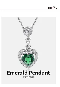 Detail of heart-shaped lab emerald pendant with sparkling zircon accents in S925 silver