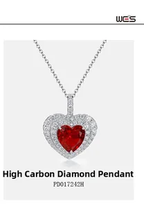 Detailed view of heart-shaped ruby pendant with sparkling double halo of white stones