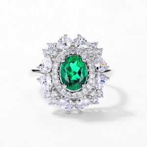 Luxurious S925 sterling silver floral ring with emerald green stone and white petals