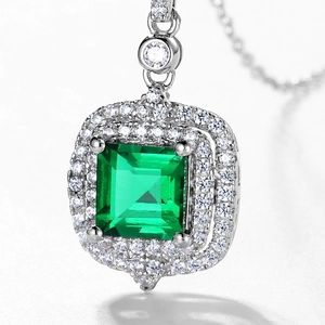 Retro S925 silver emerald pendant featuring a double halo design and silver chain
