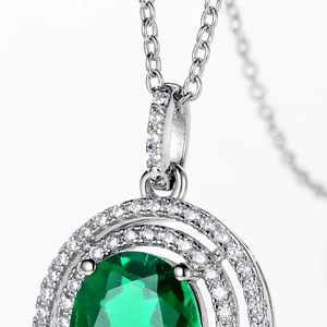 Luxurious S925 silver pendant necklace featuring an oval lab-grown emerald with pavé diamonds