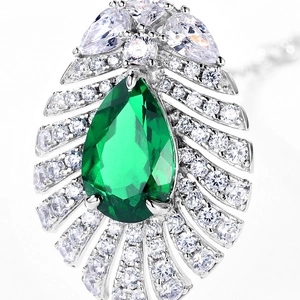 Luxurious S925 silver necklace with pear-cut emerald pendant and radiant accent stones