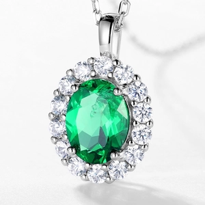 S925 sterling silver halo necklace featuring large oval-cut emerald gemstone with pavé zircon