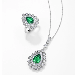S925 silver jewelry set with pear-cut emerald gemstones and pavé halo diamonds