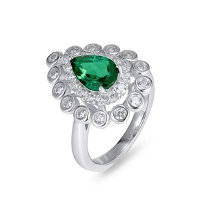 Pear-shaped emerald silver ring with double halo diamond setting on white background