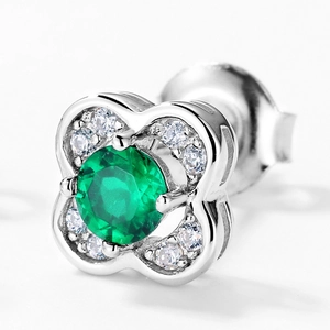 S925 silver stud earring featuring a green emerald center with white diamond petals