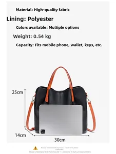 Detail view of large black lychee leather briefcase with orange straps and size reference