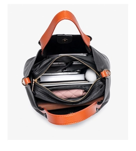 Internal view of a large capacity leather handbag showing compartments and storage space