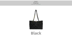 Close-up of black quilted tote bag featuring a gold chain strap and metal turn-lock closure
